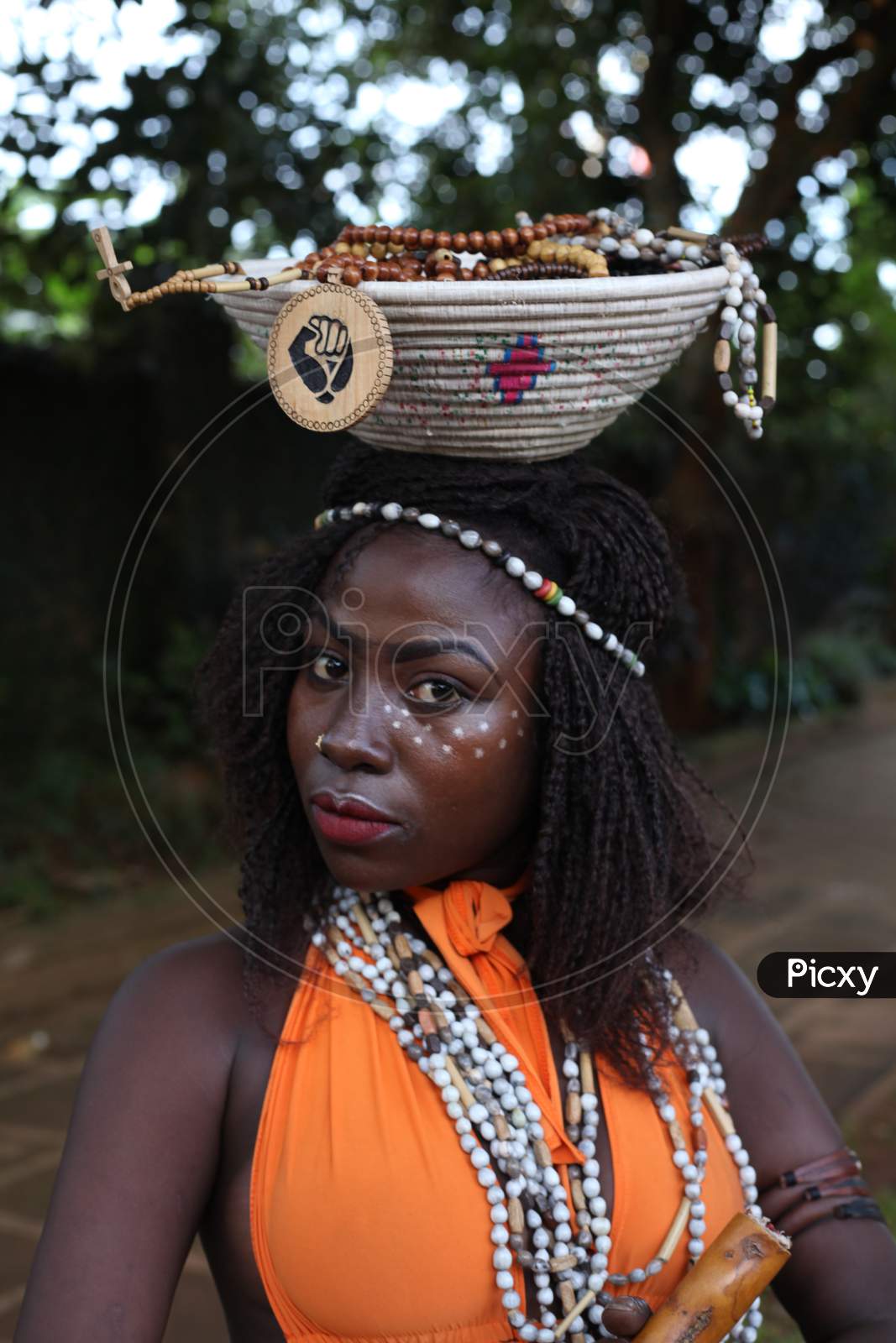 Witch doctor is a sensual Yoruba female dressed as an alluring Witch doctor