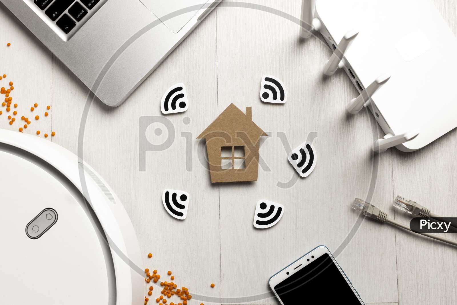 top-view wi-fi router with house figurine wireless controlled devices