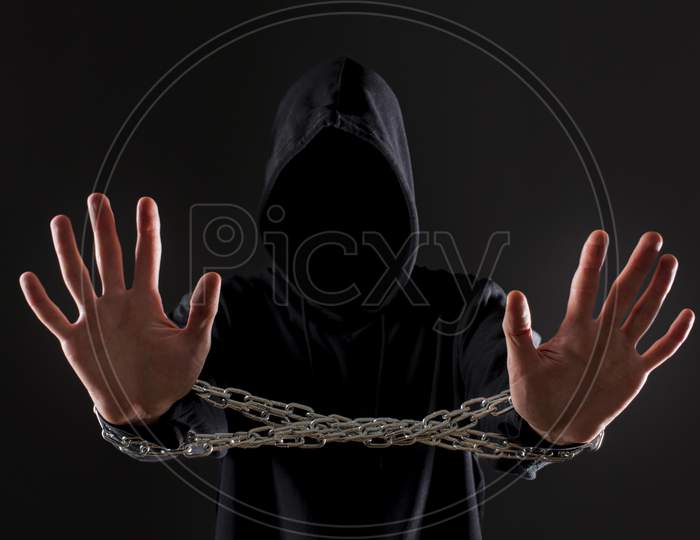 front view male hacker with metal chain around hands