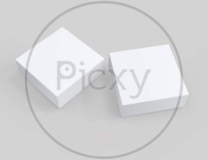 3D Rendering Of Two White Boxes Placed Besides Each Other On Grey Background. 3D Render. 3D Illustration.