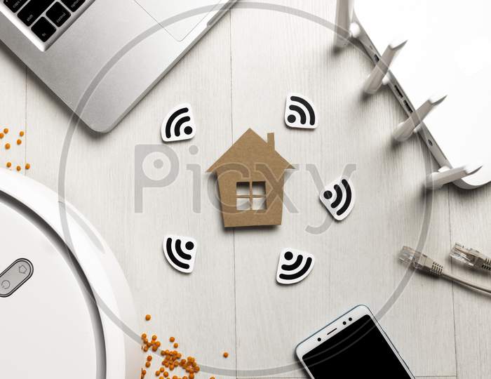 top-view wi-fi router with house figurine wireless controlled devices