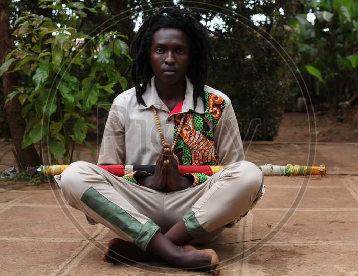 Image of Black African man raster man meditation on the floor in the ...