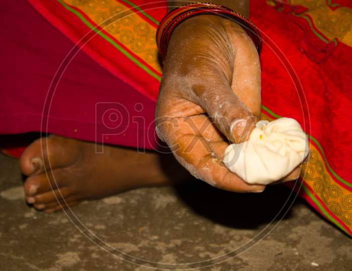 Closeup Of Indian Woman Hands Making Purse Shape Dumpling Momo ( Cooking Process )