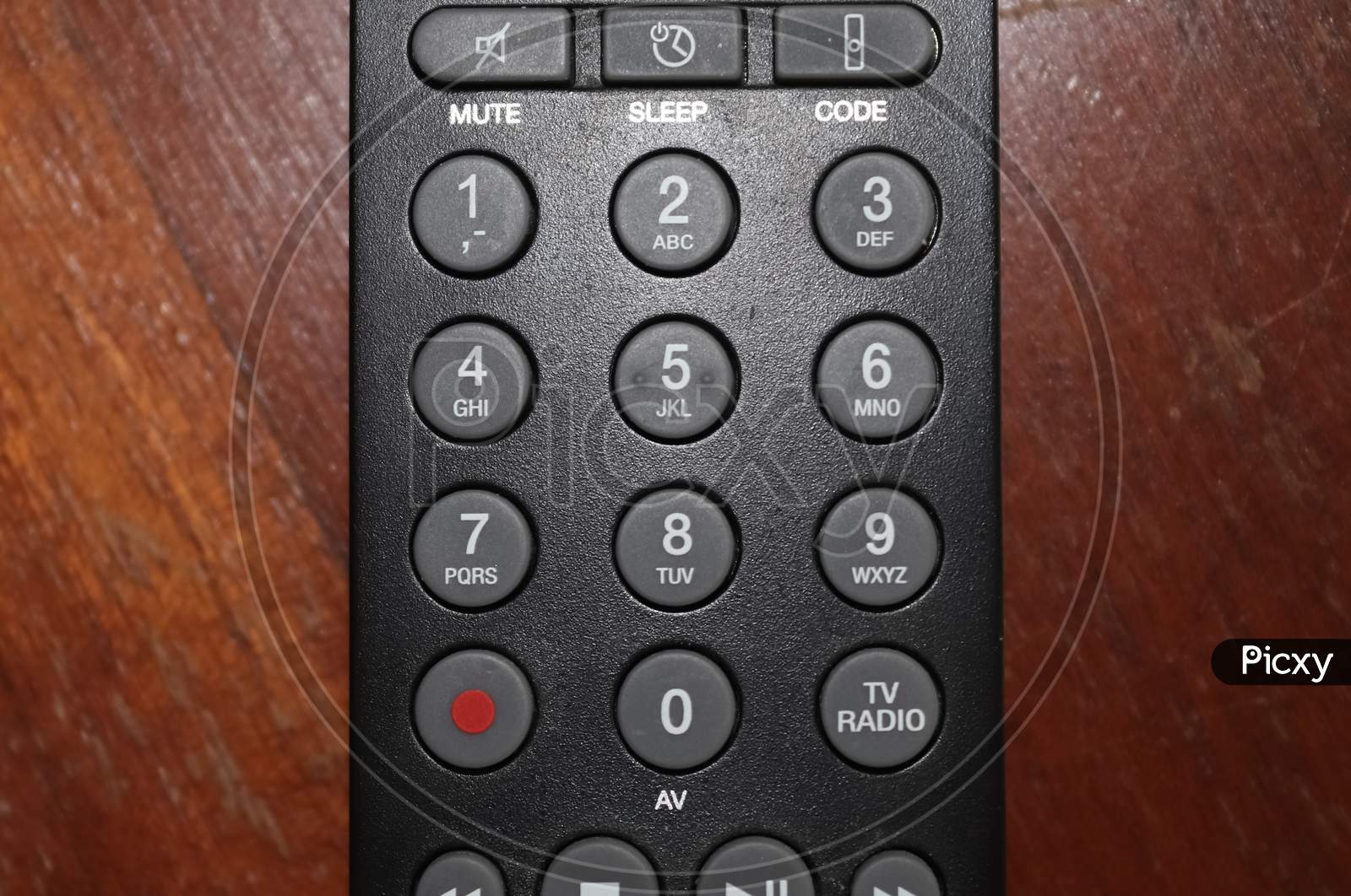 Close Up View On The Number Keys Of A Television Remote Control.