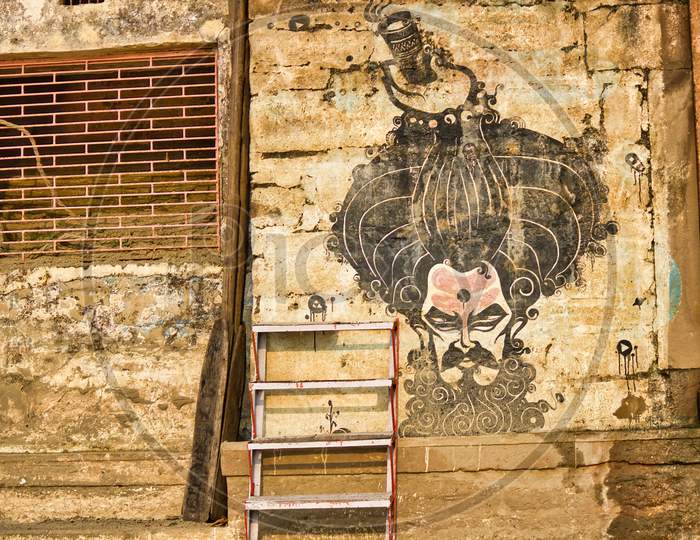 Varanasi, India - November 01, 2016: A Graffiti Of A Baba Or Sadhu On A Cracked Wall With Stair In The Front In The City Of Banaras Located In Uttar Pradesh.