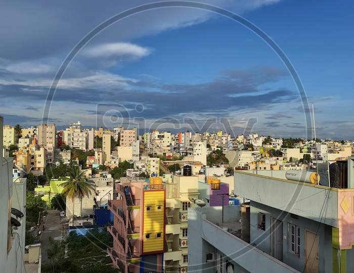 Closeup of beautiful heaven sky with cityscape and downtown view of Laggere Area at Bengaluru in a mid day.
