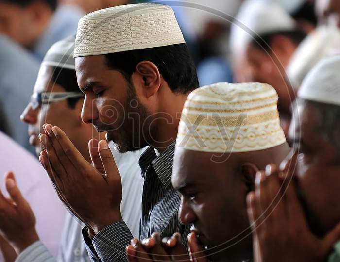 Some muslim people offering prayer namaz in the mosque.