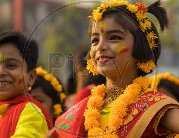 Little children celebrating the Holi, the festival of colours. It is also known as Basant Utsav.