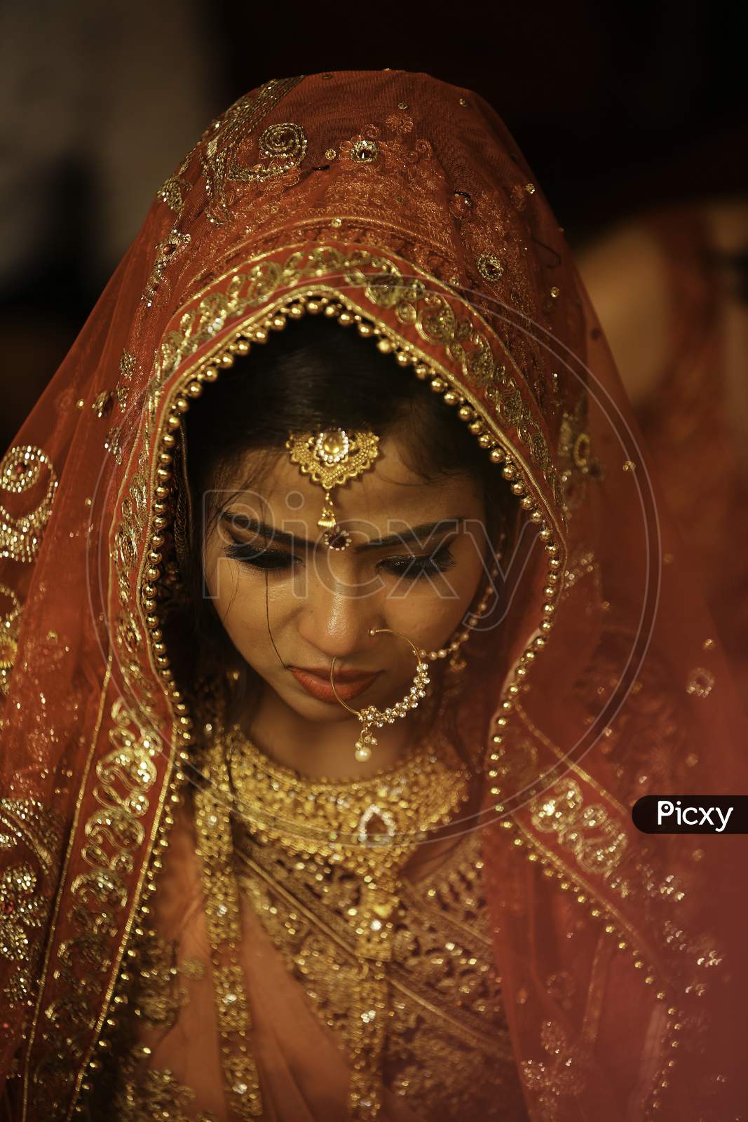 Premium Photo | Smiling Indian Bridal Wearing Red Lehenga and Jewellery