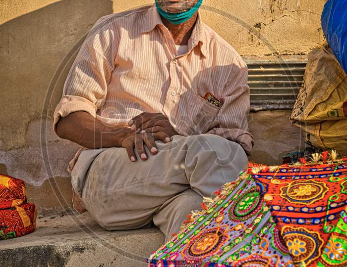 A street vendor at Amer fort selling colourful turbans.