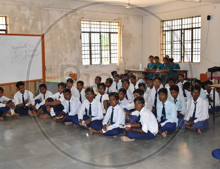 Group of unidentified Indian  students of government school inside the class room and enjoying class activity