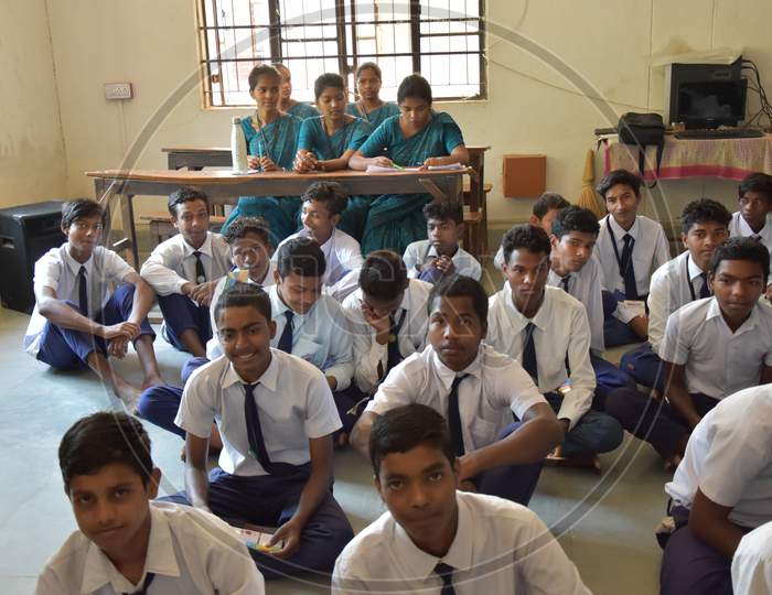 Group of unidentified Indian  students of government school inside the class  and enjoying class activity