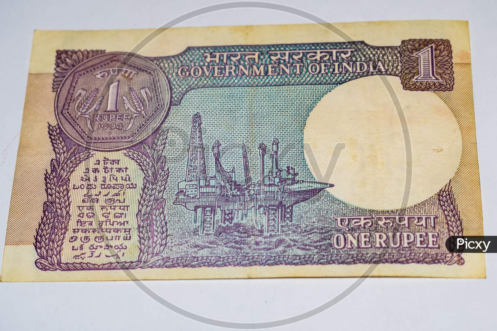 Indian One Rupee Currency Note On White Background, Government Of India One Rupee Old Banknote Indian Currency, Old Indian Currency Note On The Table