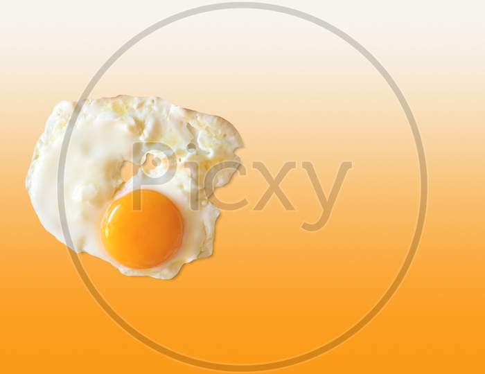 Fried Egg Over Matching Colour Background
