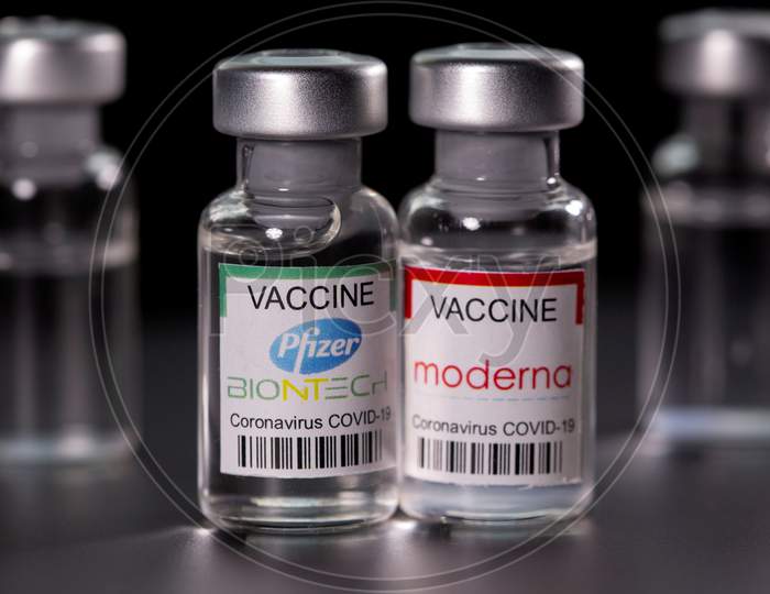 File Photo: Picture Illustration Of Vials With Pfizer-Biontech And Moderna Coronavirus Disease (Covid-19) Vaccine Labels