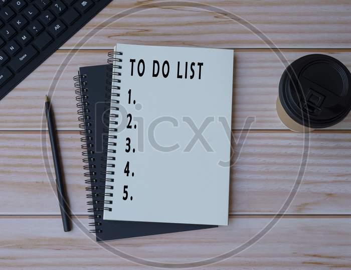 Text On Notepad On Wooden Desk - To Do List