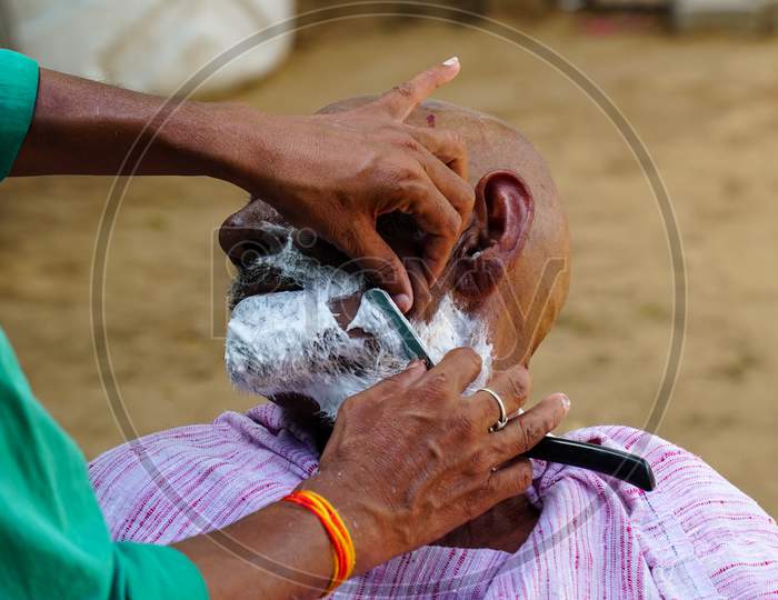 Indian Rural Landscape, Local Barber Go To Every Day Door To Door To Shave Villagers.
