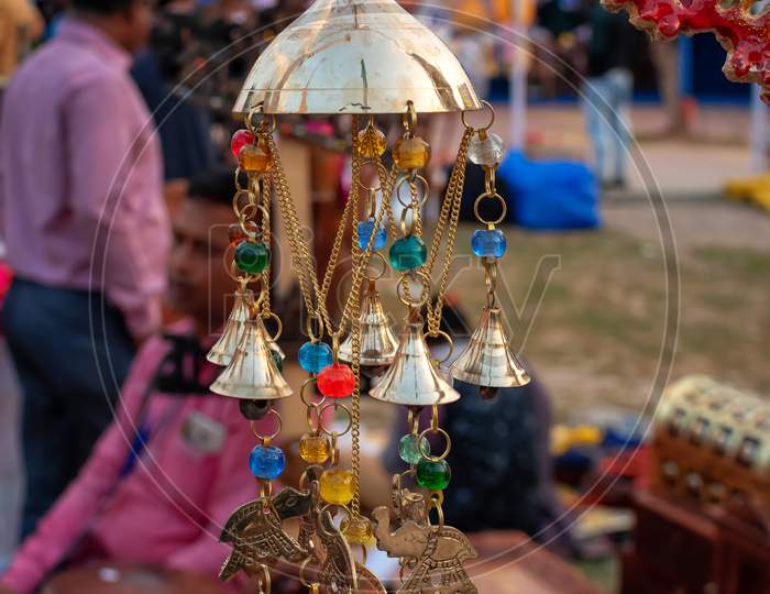 Beautiful Handmade Rajasthani Multicolour Wind Chimes Is Displayed In A Shop For Sale In Blurred Background. Indian Handicraft (Selective Focus)