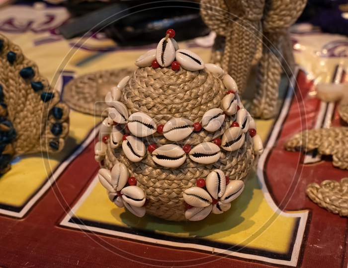 Beautiful Handmade Decorative Basket Made By Jute Is Displayed In A Shop For Sale In Blurred Background. Indian Handicraft