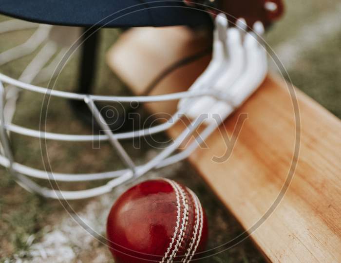 cricket bat ball and helmet