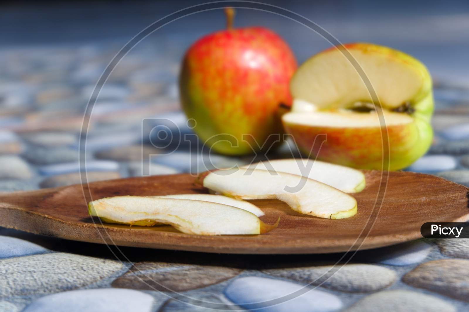Photos Of Apples In Various Styles, Some Are Still Intact, Some Are Cut With A Stone Background