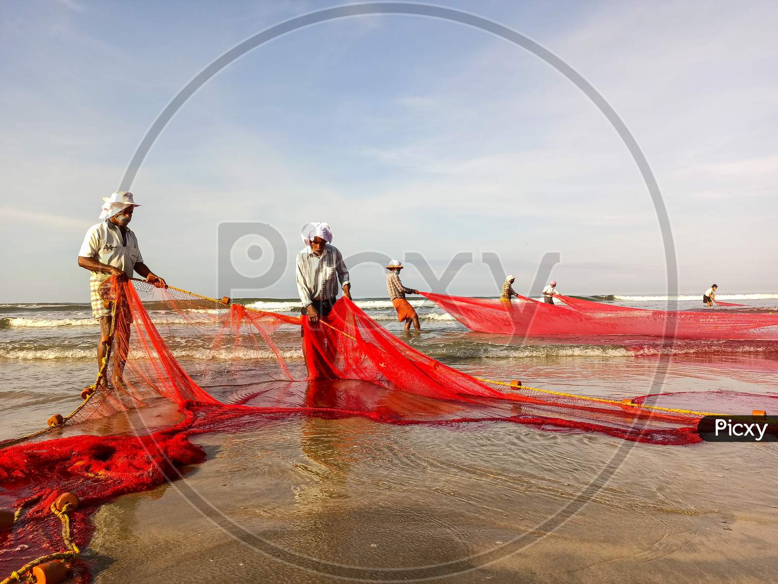 Fishermen At Beach