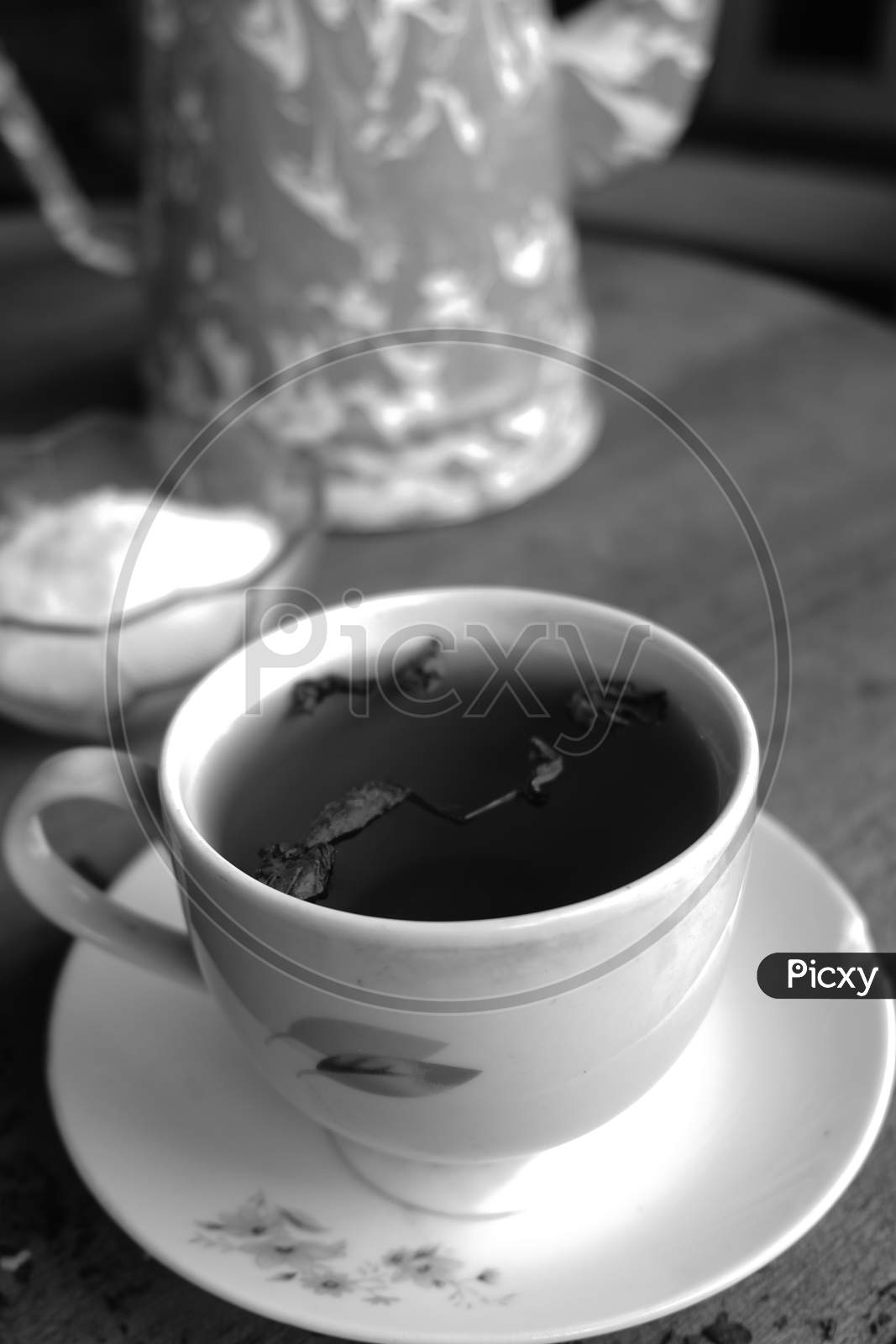Image of photo of tea and coffee on a wooden table perfect for those