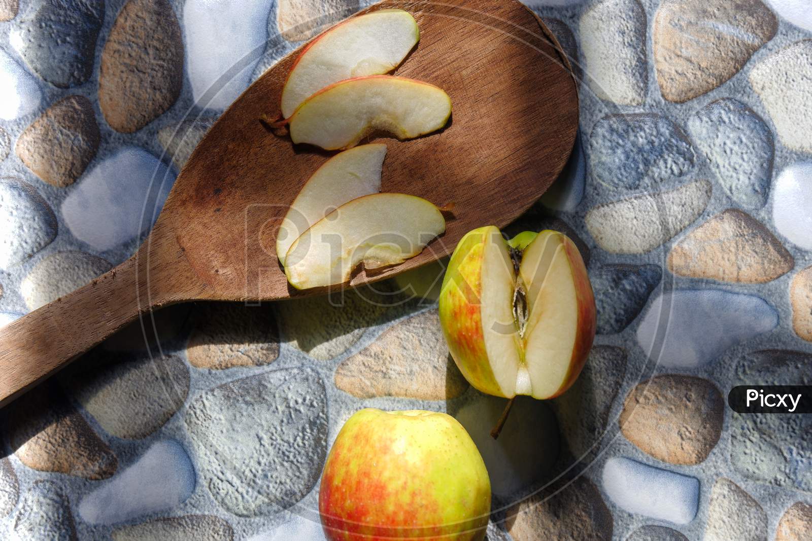 Photos Of Apples In Various Styles, Some Are Still Intact, Some Are Cut With A Stone Background