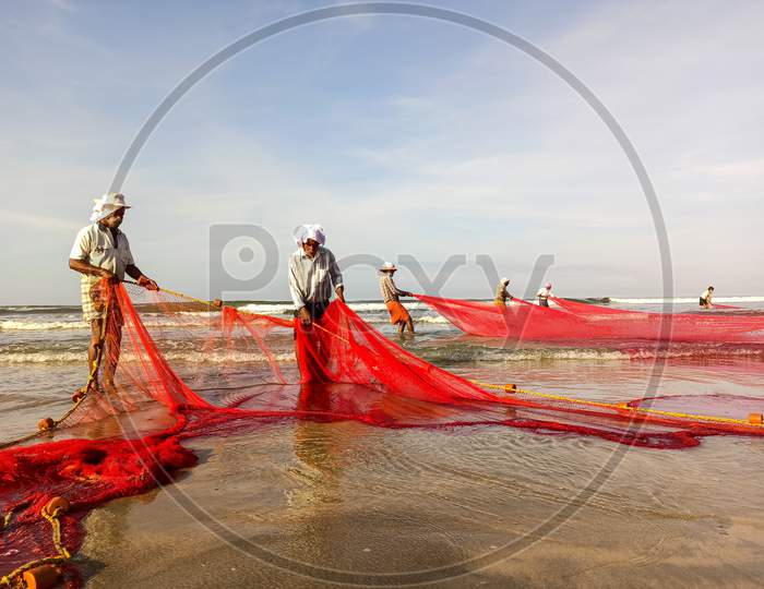 Fishermen At Beach