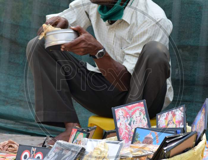 Street vendor of India having his breakfast