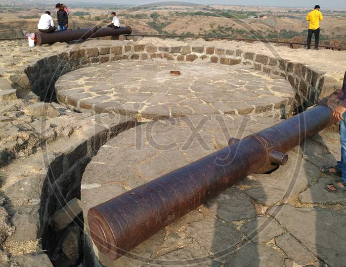Heavy historical steel cannon on fort tower