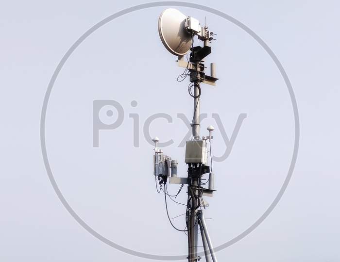 Technology on top of telecommunications GSM (5G, 4G) .The cell phone antenna on the roof of the building. Telecommunication mast antenna. Development of the system of communication