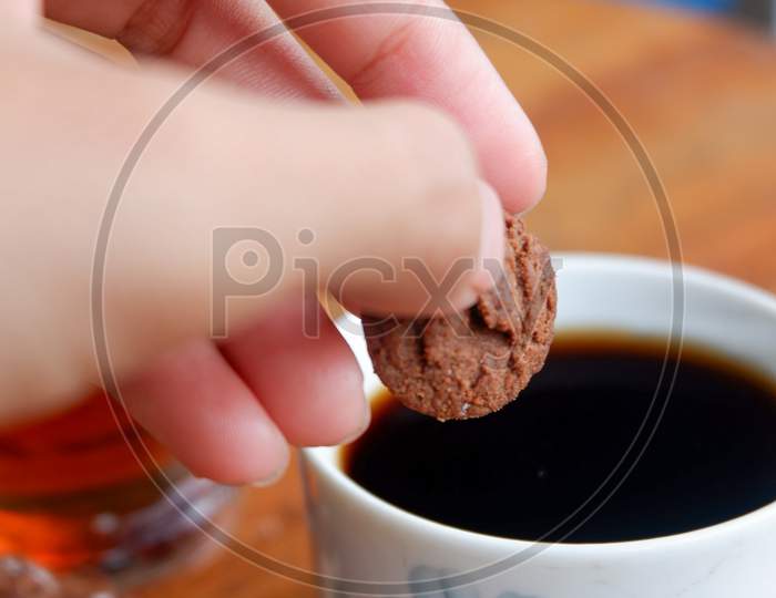 A Photo Of A Pastry And Two Glasses Of A Drink On A Wooden Table