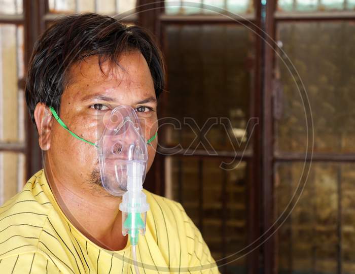 Young Boy Wearing Oxygen Mask Covid 19 Concept.