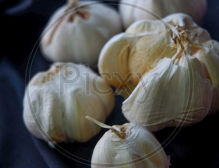 Egg And Garlic Photo On Black Background
