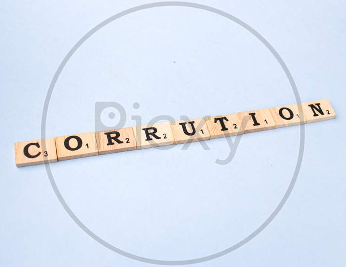 Assam, india - March 30, 2021 : Word CORRUPTION written on wooden cubes stock image.