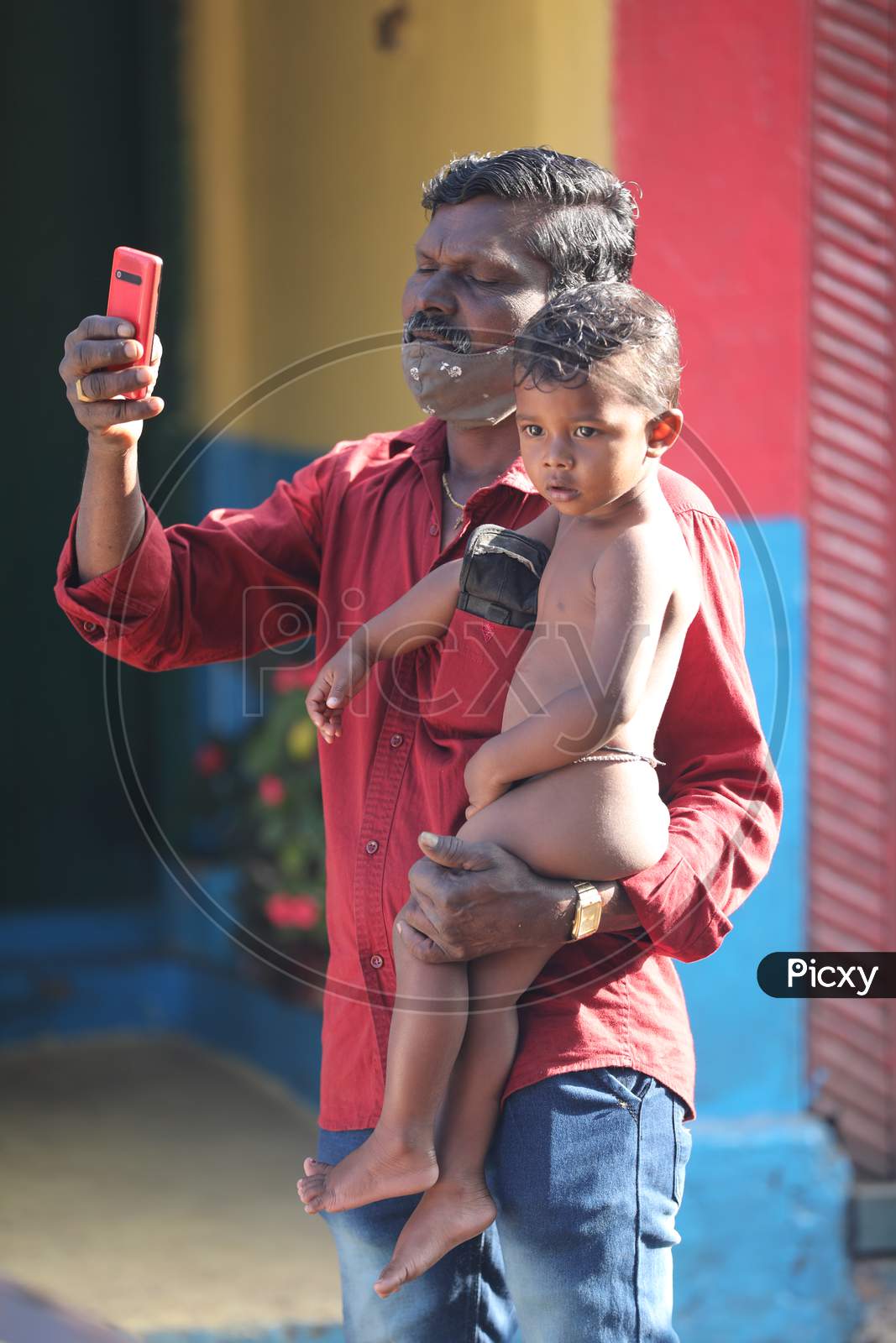 Father and child with Cell Phone