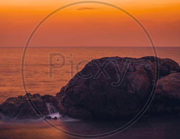 Colorful Sunset And Rock Formation In Foreground With Waves Crashing View From Galle Dutch Fort Evening, After Sundown Blue Hour, Long Exposure Photograph.