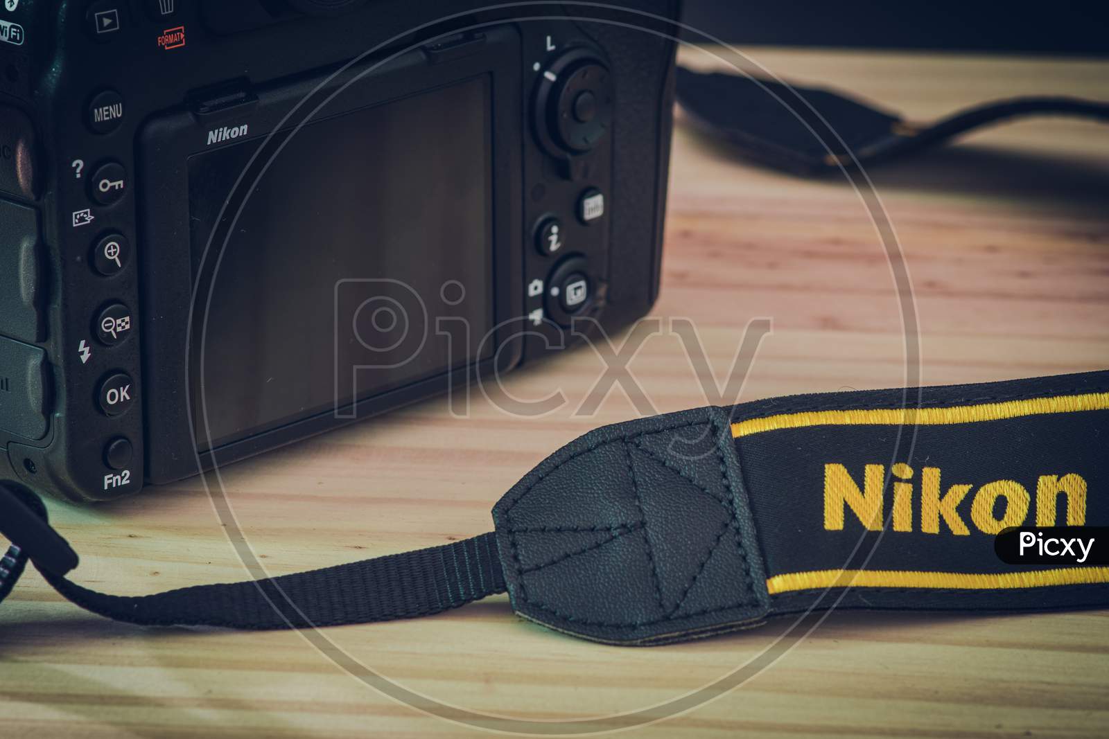 Sri Lanka - 02 17 2021: Modern Professional Level Dslr Body And Neck Trap With Nikon Brand Name Embraided On A Wooden Table, Nikon D850 Close Up Photograph.