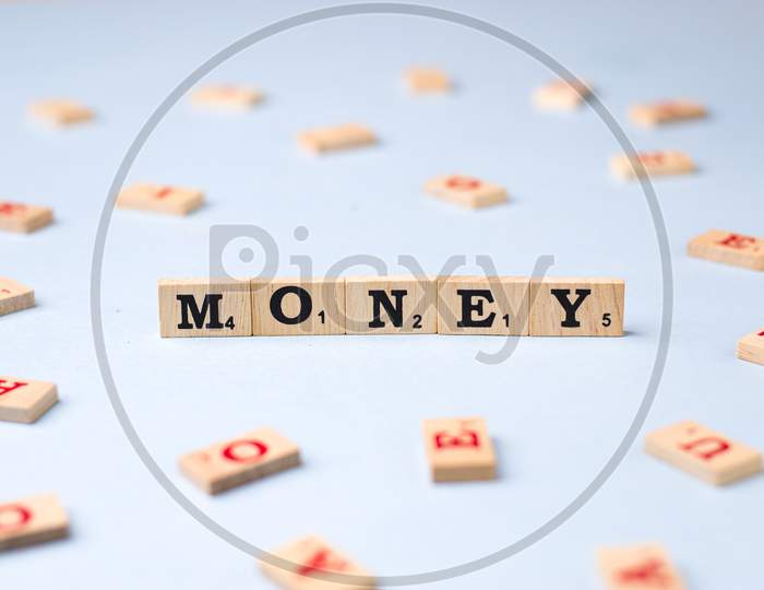 Assam, india - March 30, 2021 : Word MONEY written on wooden cubes stock image.