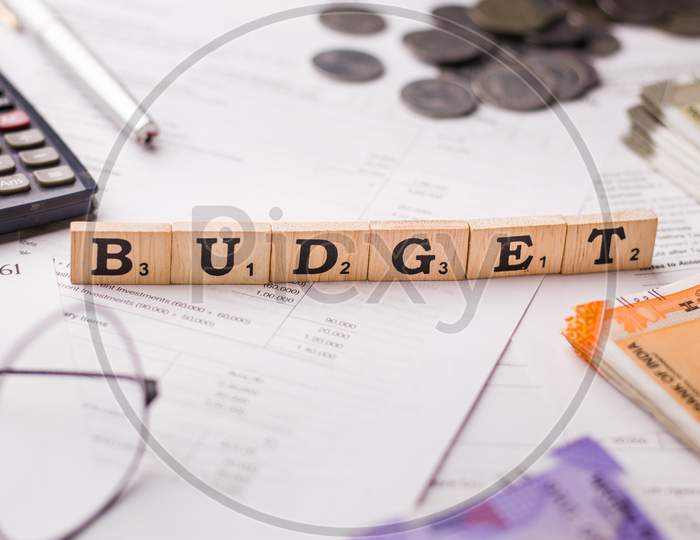 Assam, india - March 30, 2021 : Word BUDGET written on wooden cubes stock image.