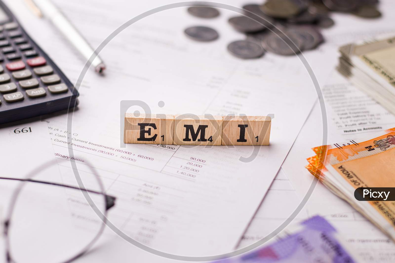 Assam, india - March 30, 2021 : Word EMI written on wooden cubes stock image.