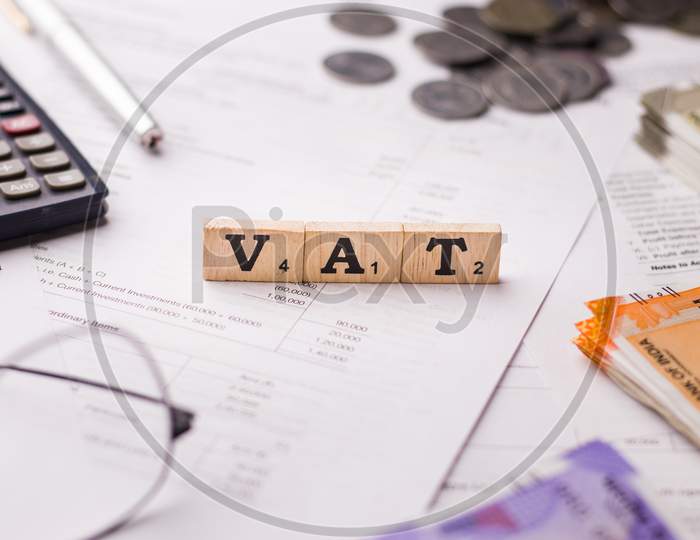 Assam, india - March 30, 2021 : Word VAT written on wooden cubes stock image.