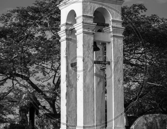 Tall White Bell Tower At The Maritime Museum In Galle Fort Black And White Photograph, Evening Bright Light Hits The Side Of The Tower.