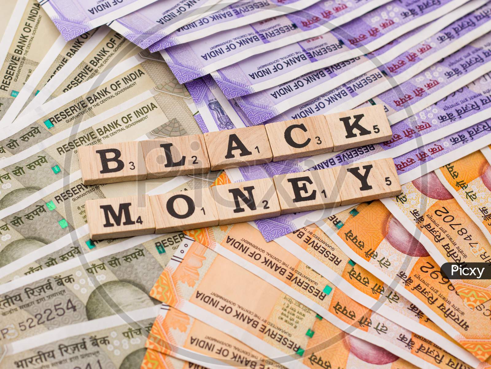 Assam, india - March 30, 2021 : Word BLACK MONEY written on wooden cubes stock image.