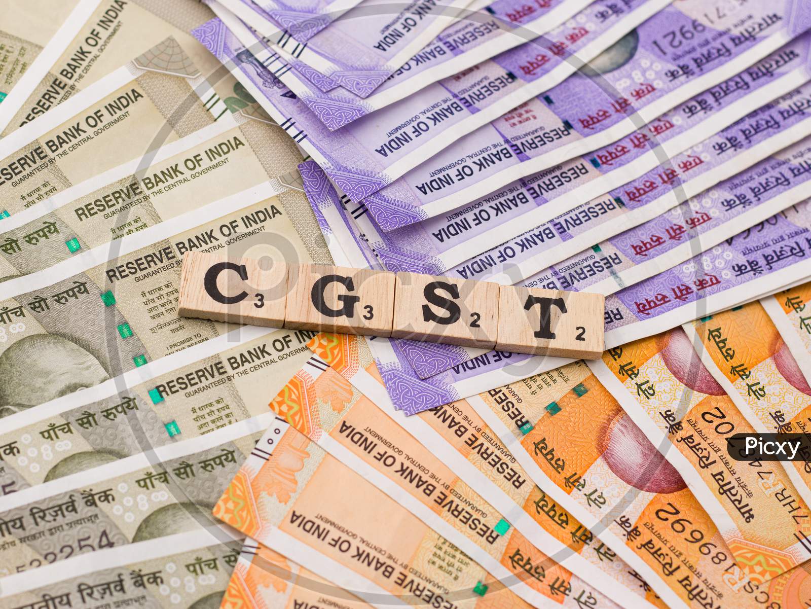 Assam, india - March 30, 2021 : Word GST written on wooden cubes stock image.