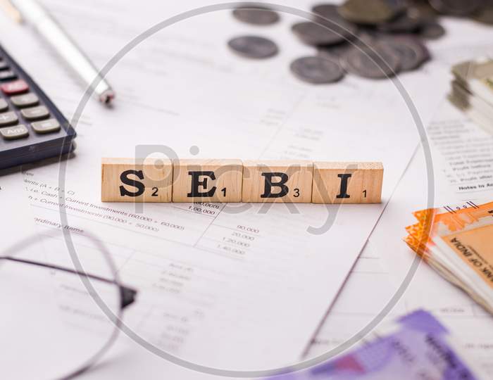 Assam, india - March 30, 2021 : Word SEBI written on wooden cubes stock image.