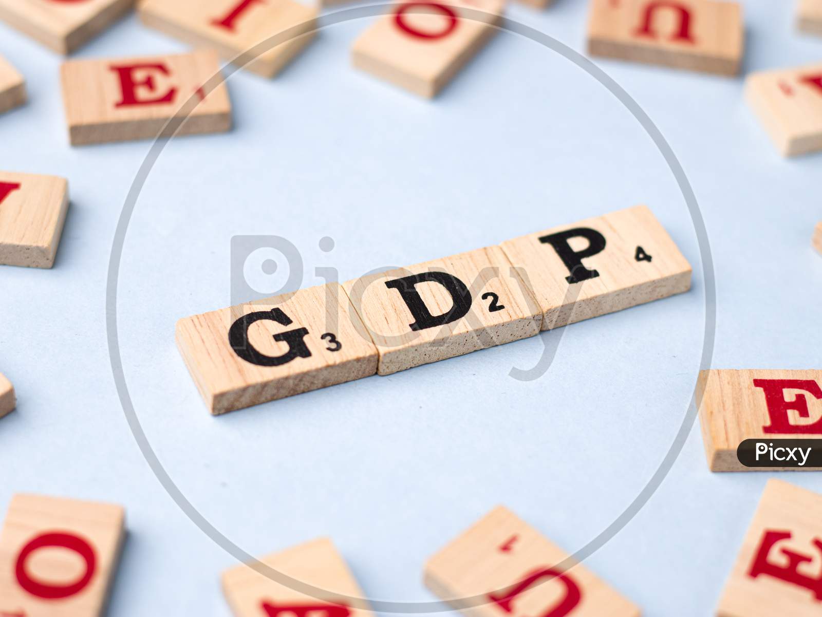 Assam, india - March 30, 2021 : Word GDP written on wooden cubes stock image.