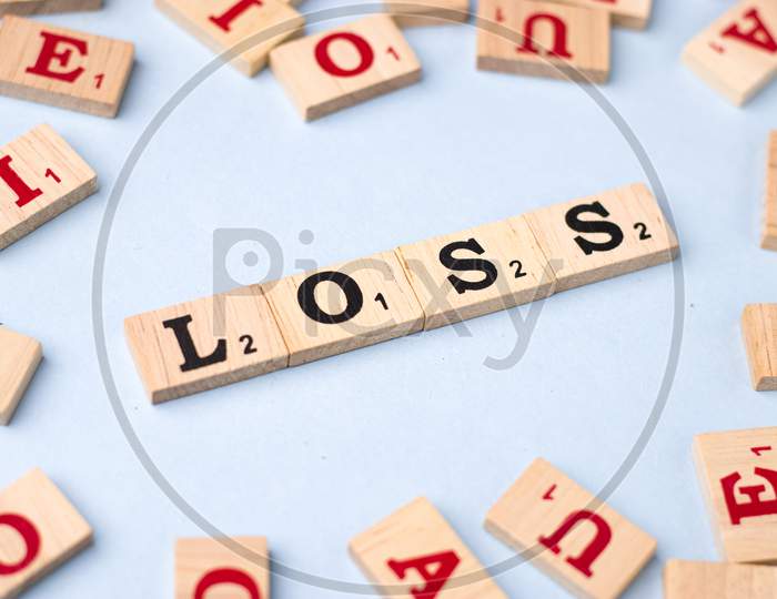 Assam, india - March 30, 2021 : Word LOSS written on wooden cubes stock image.