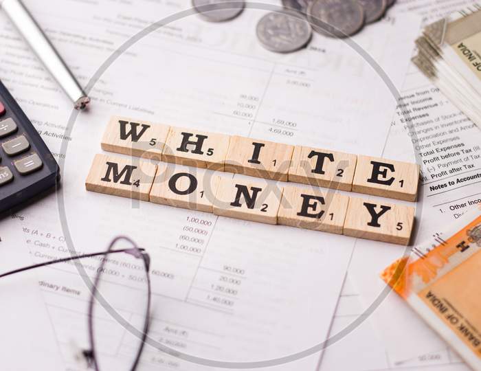 Assam, india - March 30, 2021 : Word WHITE MONEY written on wooden cubes stock image.